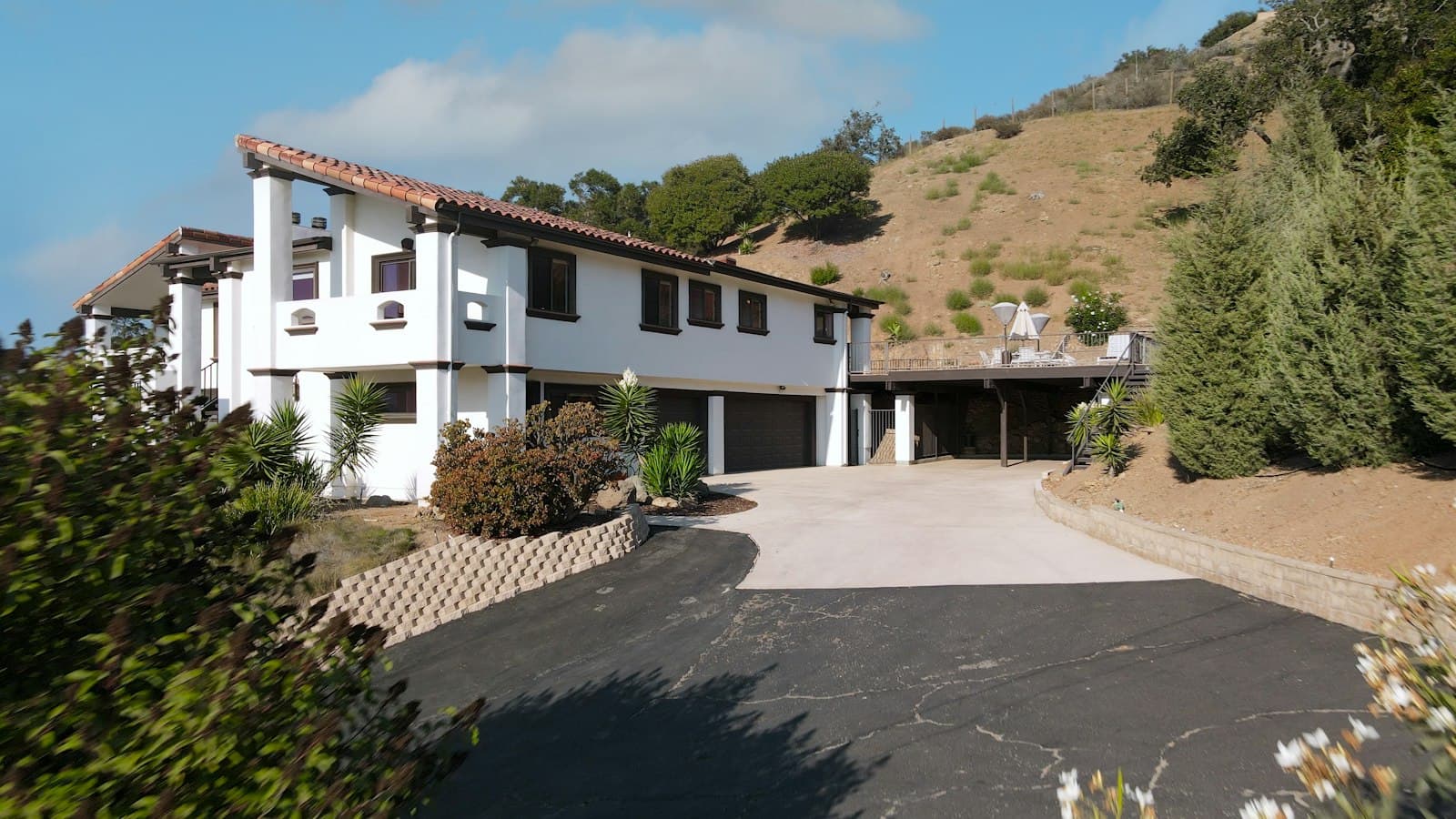 Large home with a freshly paved driveway