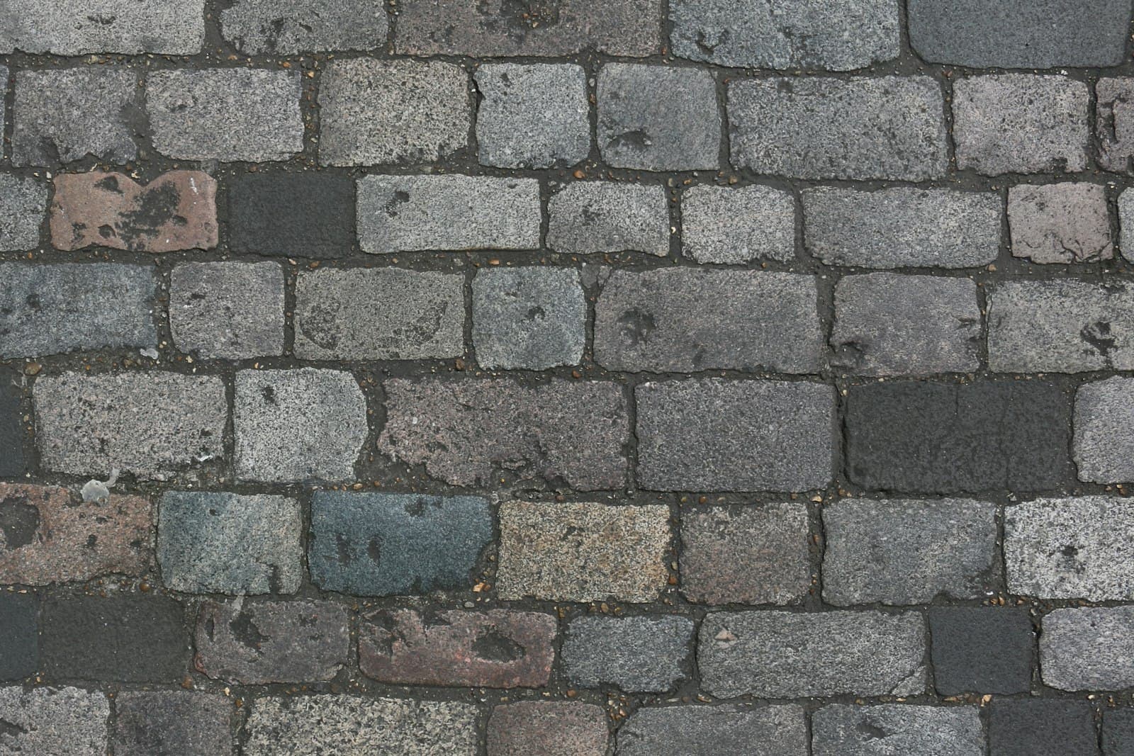 Close-up of gray and tan interlocking pavers
