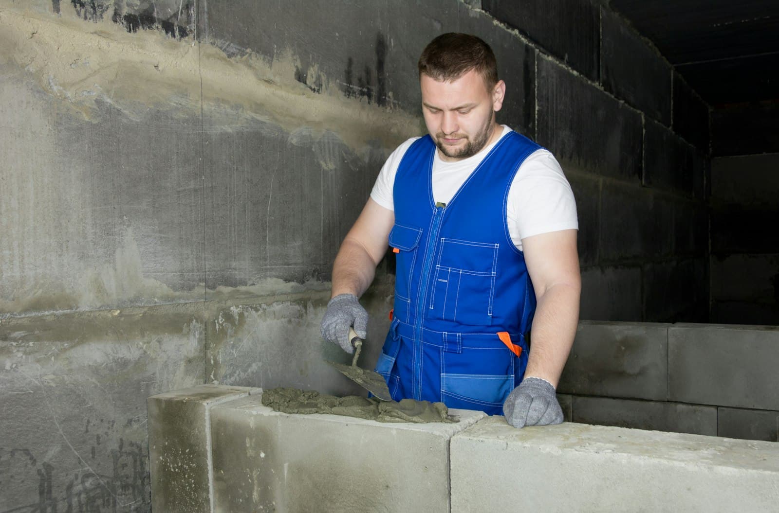 Worker finishing a concrete form